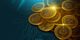 Gold coins feature cryptocurrency symbols on a digital circuit background.