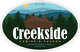 Creekside Cabins & Tavern logo with a cabin in a forest setting and mountains in the background.