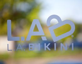 Logo on glass: L.A.B L.A. BIKINI with a heart-shaped design.
