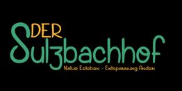 Der Schriftzug "Der Sulzbachhof" mit dem Slogan "Natur Erleben - Entspannung Finden".