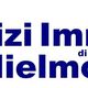 Logo "Servizi Immobiliari di Guglielmo Amore" con icona di casa e frecce blu.
