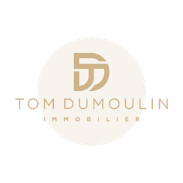 Logo beige et or avec les initiales "TD" et le texte "Tom Dumoulin Immobilier".