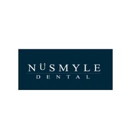 Nüsmyle Dental logo with white text on a dark blue background.