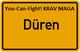 Gelbes Schild mit "You-Can-Fight! KRAV MAGA" und "Düren" in der Mitte.