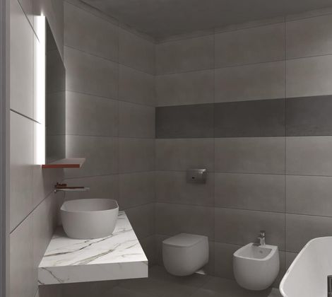 Bagno moderno con lavabo, WC, bidet e vasca. Piastrelle grigie alle pareti.