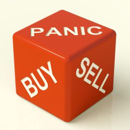 Red cube with "PANIC," "BUY," and "SELL" on its sides, symbolizing market decision-making.