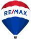 Heißluftballon in Rot, Weiß, Blau mit "RE/MAX"-Logo.