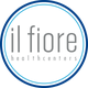 Logo met tekst "il fiore healthcenters" in grijs binnen een witte cirkel met blauwe rand.