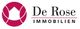 Logo von De Rose Immobilien mit rotem Kreis und Hausmotiv.