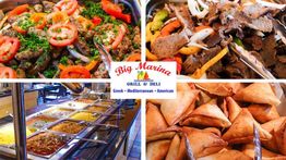 Buffet with various Mediterranean dishes, including meats, salad, and pastries at Big Marina Grill.
