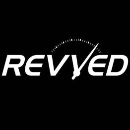 "Revved logo with a speedometer needle, signifying speed and energy on a black background."