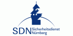 Logo des Sicherheitsdienstes Nürnberg (SDN) mit stilisiertem Turm und blauer Schrift.