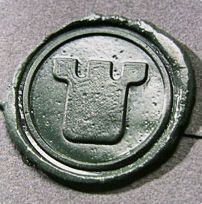 Wappen-Siegel mit einem stilisierten Turm auf Wachssiegel.
