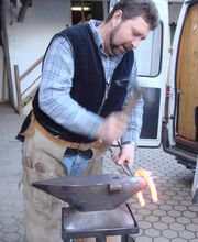 Hufschmied Schnelle Logo