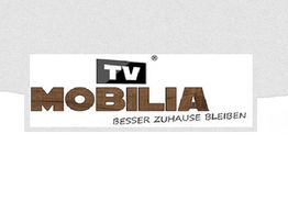 Logo mit Text "TV Mobilia, Besser Zuhause Bleiben" auf weißem Hintergrund.