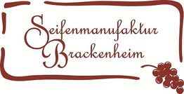Seifenmanufaktur Brackenheim Logo, verziert mit Weintraubenmotiv und geschwungenem Rahmen.