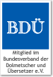 BDÜ-Logo, Mitglied im Bundesverband der Dolmetscher und Übersetzer e.V., blau-weißes Design.