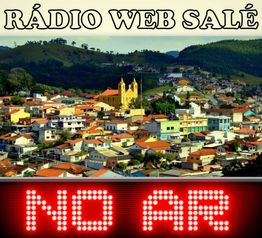Cidade ao fundo com placas "Rádio Web Salé" e "NO AR" em destaque na imagem.