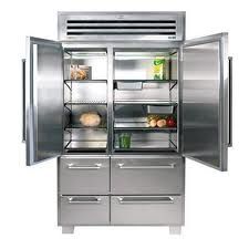 Open stainless steel refrigerator with food items on shelves and drawers beneath.
