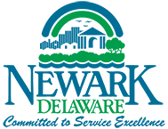Logo of Newark, Delaware with buildings, trees, and motto: "Committed to Service Excellence."