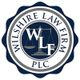 Logo of Wilshire Law Firm PLC with a scales of justice design and the initials WLF.