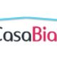 Logo di "Arredo Casa Biancheria" con testo in rosso e nero sotto una linea azzurra curva.