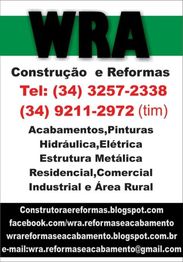 Cartaz de empresa WRA, construção e reformas, com telefones de contato e serviços oferecidos.