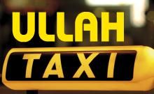 Gelbes Taxischild mit Schriftzug "ULLAH TAXI".