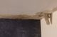 Ceiling corner with water damage, peeling paint, and visible discoloration.