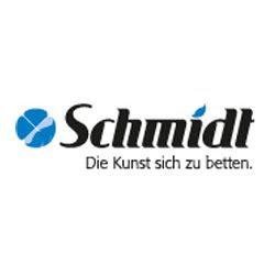 Logo mit dem Schriftzug "Schmidt" und dem Slogan "Die Kunst sich zu betten", blaues Symbol links.