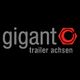 Logo mit dem Text "Gigant Trailer Achsen" in Grau und Rot auf schwarzem Hintergrund.