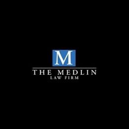 Logo of The Medlin Law Firm with a blue "M" on a black background.