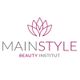Logo von MAINSTYLE Beauty Institut mit einem stilisierten, lila Lotusblüten-Design darüber.