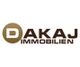 Logo von Dakaj Immobilien mit braunem "D" und Schriftzug in Braun auf weißem Hintergrund.