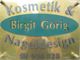 Schild mit der Aufschrift: "Kosmetik & Nageldesign, Birgit Görig, ☎ 950 828".