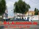 Autohandel M&L Automobile mit Bäumen im Hintergrund. Text: "M-L-Automobile.de, Tel. (0345) 5 60 62 83".