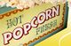Schild mit der Aufschrift "Hot Popcorn Fresh" und Popcorn an den Rändern.