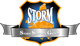 Wappen mit "STORM"-Schriftzug und grauem Band, zeigt Europakarte in Orange auf dunklem Hintergrund.