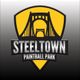 Logo for Steeltown Paintball Park featuring a yellow shield with a bridge design.