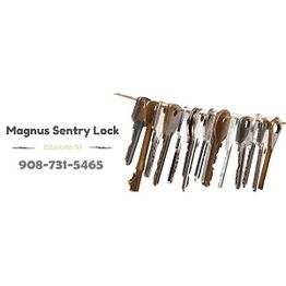 Keys hanging with "Magnus Sentry Lock" text and phone number, 908-731-5465, on white background.