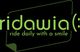 Grüner Schriftzug "ridawia - ride daily with a smile" auf schwarzem Hintergrund.