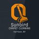 Orange vacuum logo for Sunbird Carpet Cleaning, Harrison, NY, on a dark background.