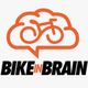 Logo arancione di una bici in un fumetto, con testo "BIKE IN BRAIN" in nero.