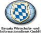 Ein blau-weißes Abzeichen auf einer Weltkugel mit dem Text "Bavaria Wirtschaftsdienst GmbH".