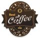 Logo ovale marrone con la scritta "Real Coffee" e chicchi di caffè, dal 1982.