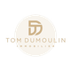 Logo beige et or avec les initiales "TD" et le texte "Tom Dumoulin Immobilier".