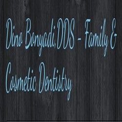 "Dino Bonyadi DDS - Family & Cosmetic Dentistry on a dark wooden background."