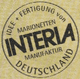 Stempel mit dem Text: "Idee + Fertigung von Marionetten Interia Manufaktur Deutschland".