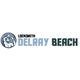 Logo with a locksmith holding tools next to the text: "LOCKSMITH DELRAY BEACH".