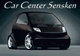 Kleines schwarzes Auto vor grauem Hintergrund, Text "Car Center Sensken" darüber.